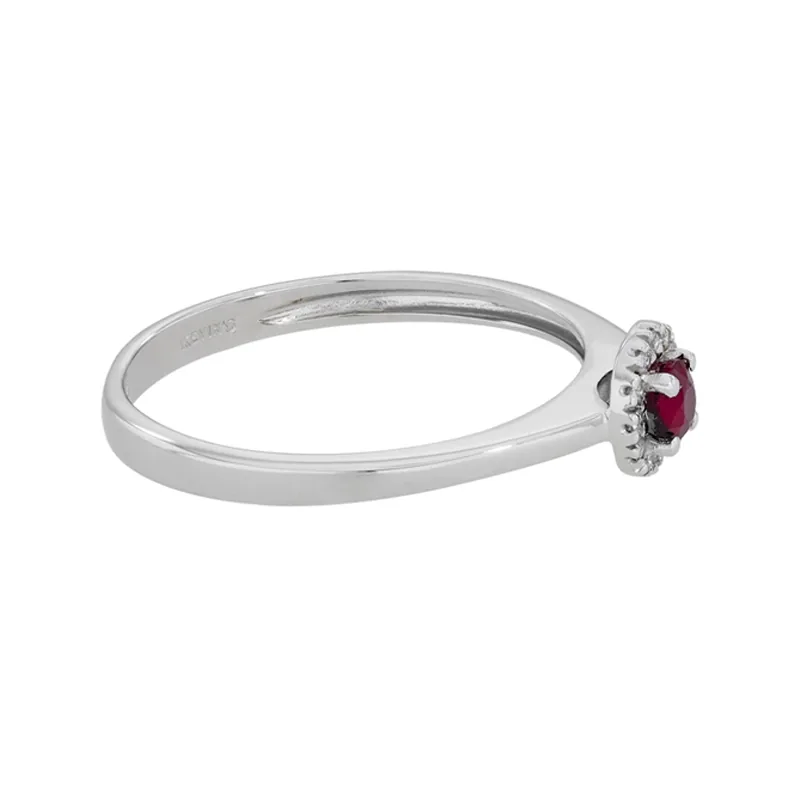 Anillo en oro blanco de 18 Kilates, con rubí central de 0.23 Ct y decoración en diamantes de 0.06 Ct